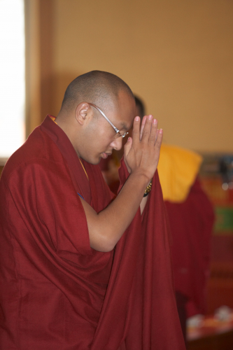 6.3.12-KTD-Karmapa-Prostrate-to-the-Buddha-Statue